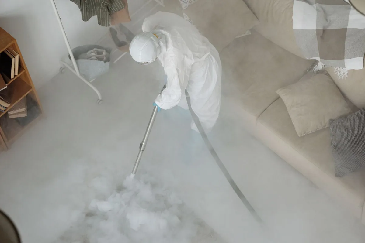 Biohazard cleanup technician in protective equipment, Fair Oaks Ranch, TX